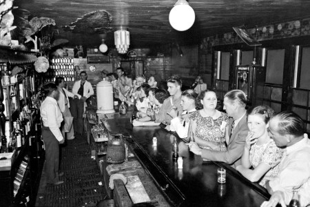Russell Lee - Drinking at the bar, crab boil night, Raceland, Louisiana, 1938