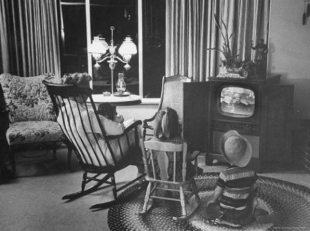 leonard-mccombe-children-and-baby-sitter-watching-tv