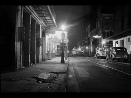 1940s-street-light-with-cars-and-storefronts