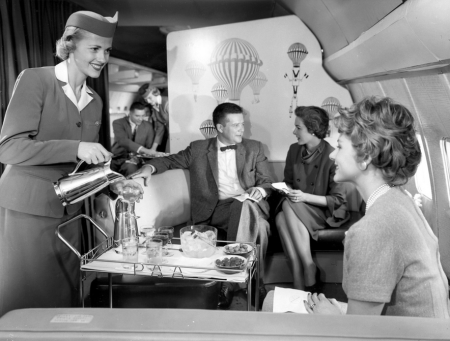 a-pan-am-stewardess-serves-ice-water-and-olives-aboard-the-boeing-707-date-unknown.jpg