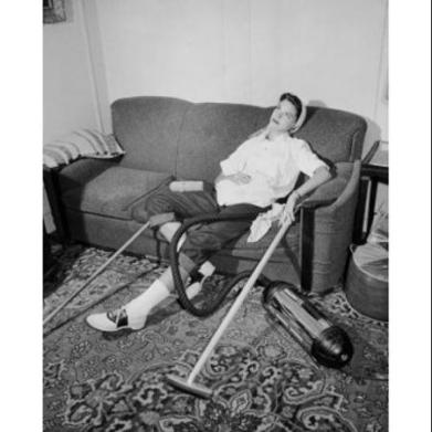 high-angle-view-of-a-young-woman-resting-on-a-couch-poster-print-18-x-24_2277969